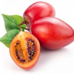 15096051 – tamarillo fruits with leaves on white background.